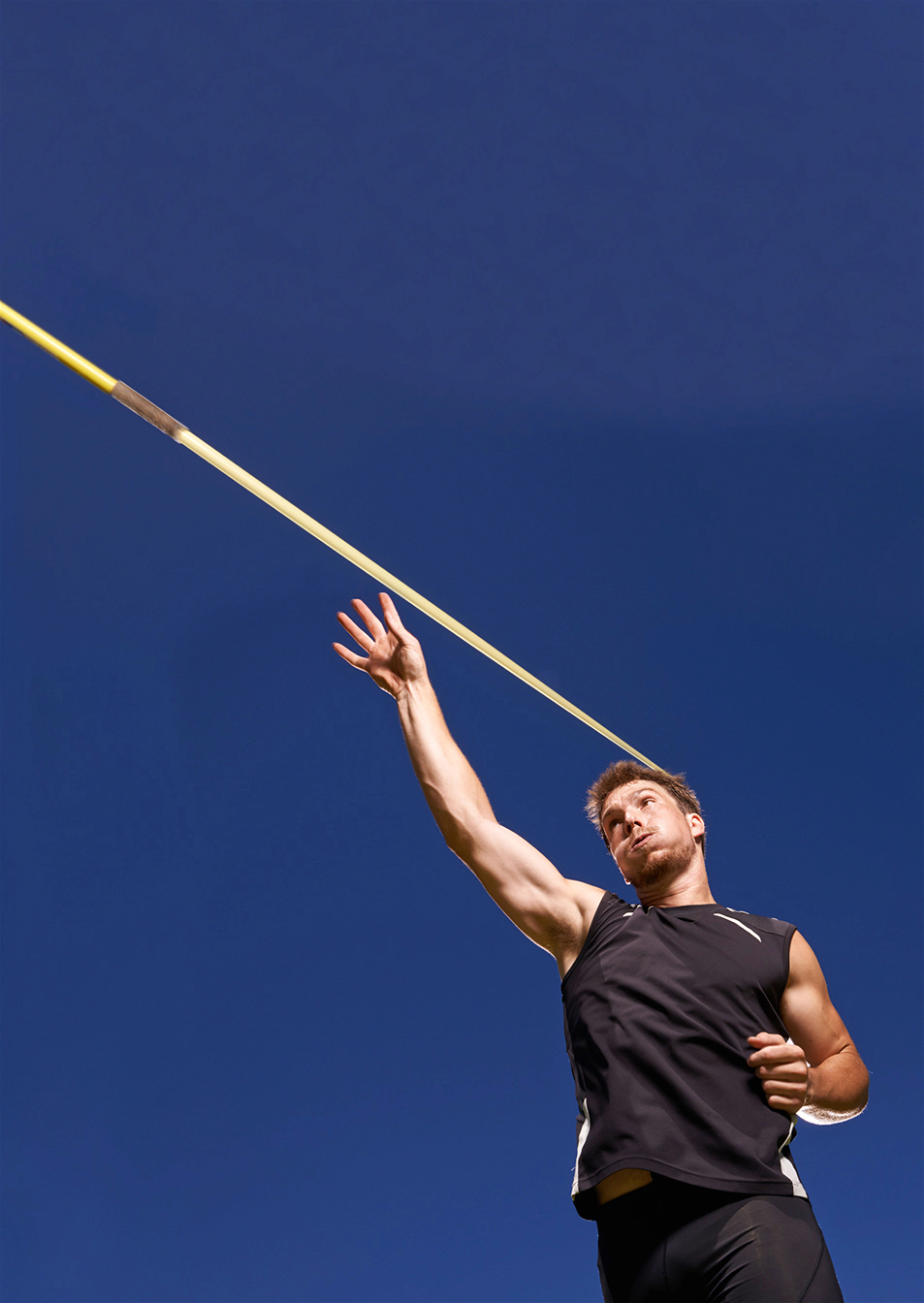 this is going the distance. Shot of a lone man throwing a javeli