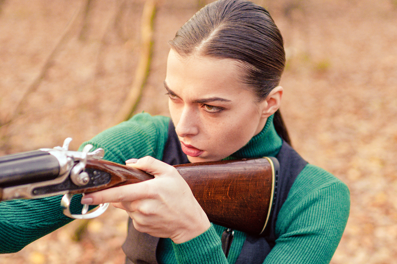 hunter carry rifle. Target shot. female hunter in forest. woman with weapon. successful hunt. hunting sport. girl with rifle. chase hunting. Gun shop. military fashion. achievements of goals